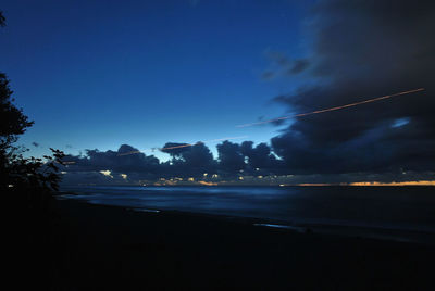 Scenic view of sea against sky at night