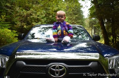 Boy sitting in car