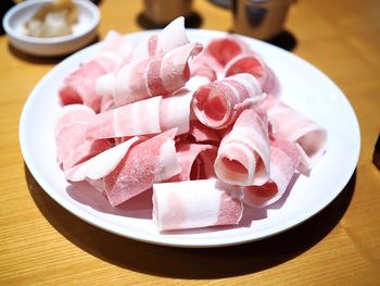 Close-up of ice cream served on table