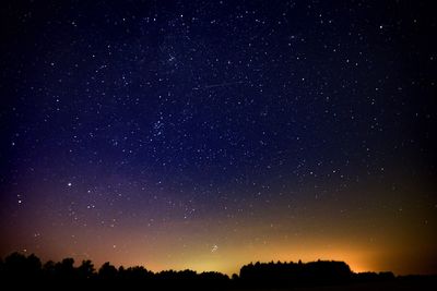 Low angle view of stars in sky at night