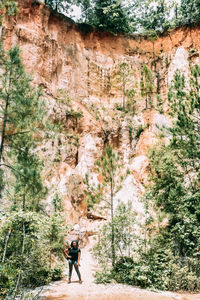 Full length of man walking on rocks