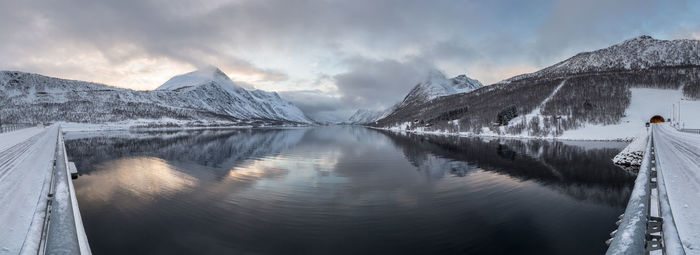 Scenic view of lake against cloudy sky