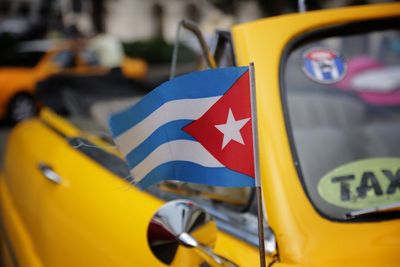 Close-up of cuban flag on car