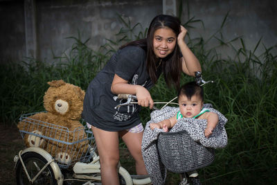 Portrait of mother and son on land vehicle