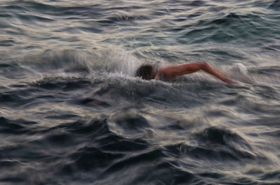 Person swimming in sea