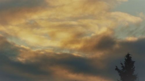 Low angle view of dramatic sky during sunset