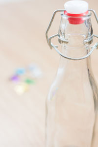 Close-up of empty bottle on table