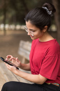 Girl sitting on mobile phone