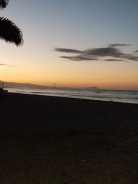 Scenic view of sea against sky at sunset