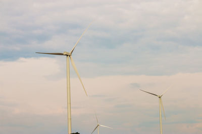 Low angle view of wind turbine against sky