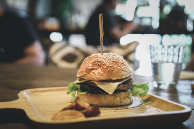 Close-up of burger in serving tray on table