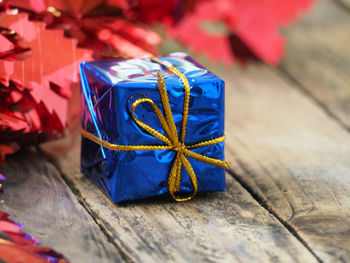 Close-up of gift box on wooden table