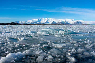 Scenic view of snowcapped landscape against sky