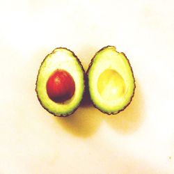 Close-up of fruit over white background