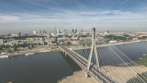 High angle view of bridge over river amidst buildings in city