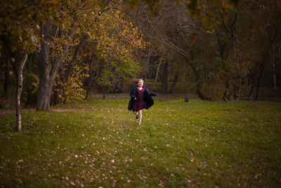 Rear view of young woman in autumn