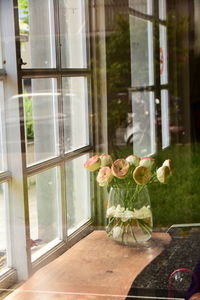 Flower vase on window sill