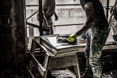 Low section of man working at construction site