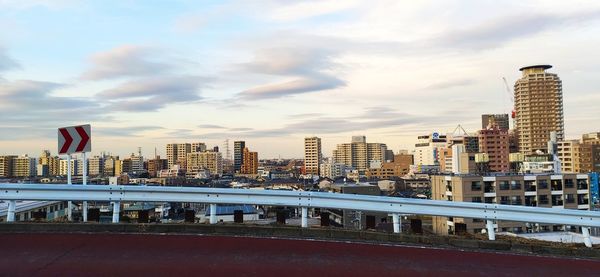 Modern buildings against sky in city