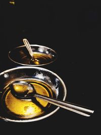 Close-up of drink on table against black background