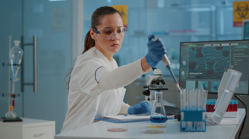 Female scientist experimenting at laboratory