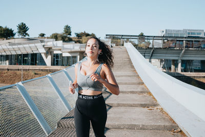 Female athlete running on steps