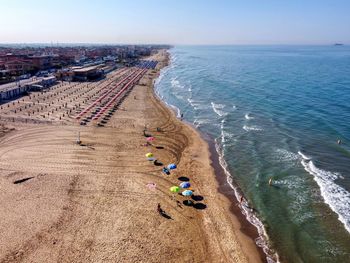 High angle view of people on beach against sky