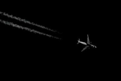 Low angle view of airplane flying in sky