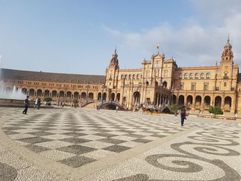 Group of people in front of historical building