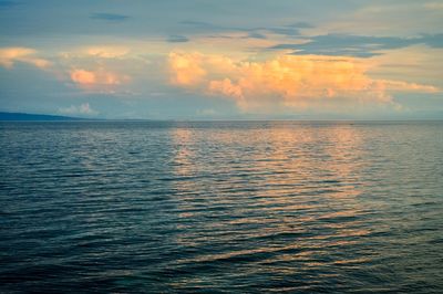 Scenic view of sea against cloudy sky