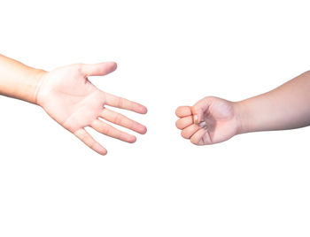 Close-up of hands over white background