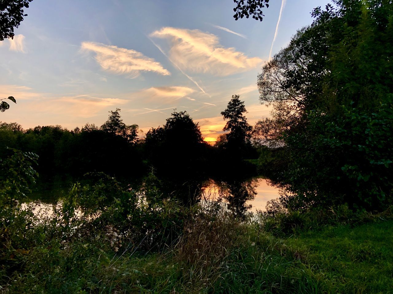 SCENIC VIEW OF SUNSET OVER LAKE