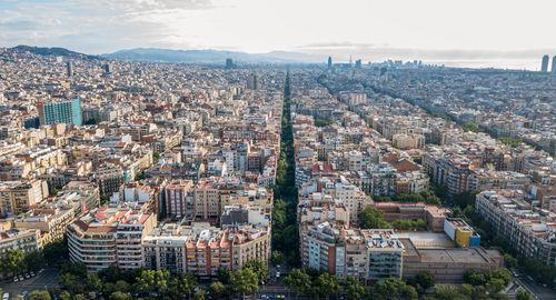 High angle view of buildings in city against sky