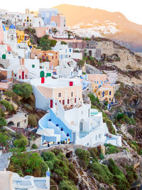 Traditional white cave houses on a cliff on the island santorini, cyclades, greece