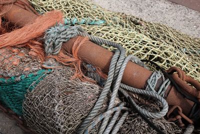 High angle view of fishing nets with pole and ropes