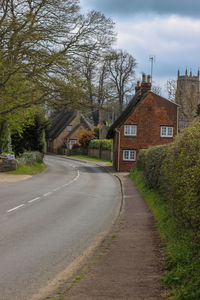 Street amidst buildings against sky