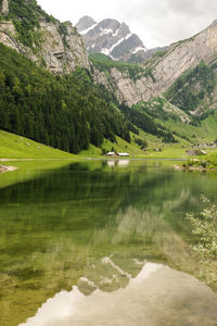 Scenic view of lake with mountains in background