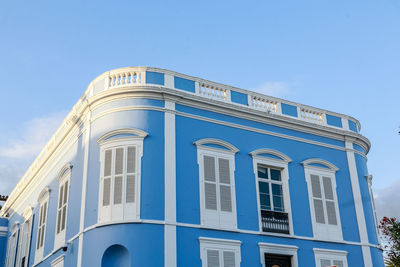 Low angle view of building against clear blue sky