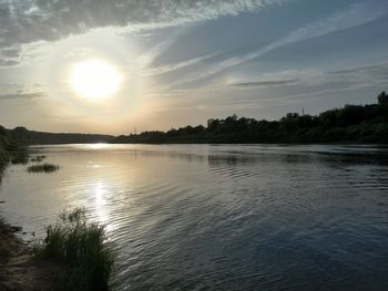 Scenic view of lake at sunset