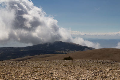 Scenic view of arid landscape against sky