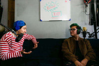 Two young adults having a chat for a podcast