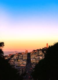 Buildings in city at sunset