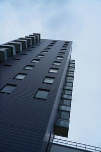 Low angle view of office building against sky