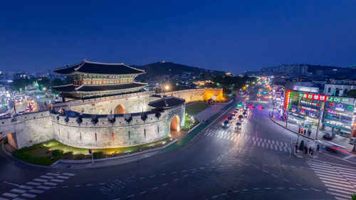 High angle view of buildings in city at night