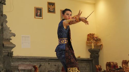 Young man in costume practicing martial arts