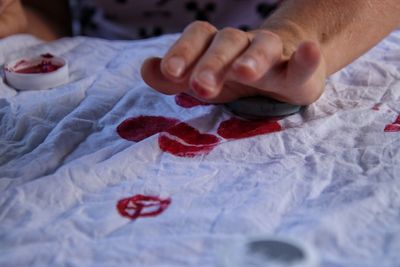 Woman stamps on fabric 