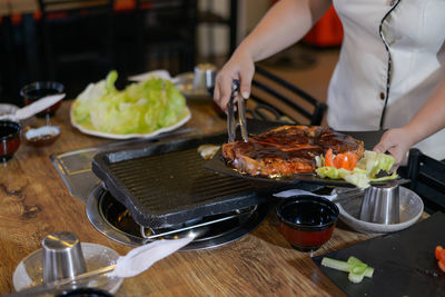 Man preparing food on table