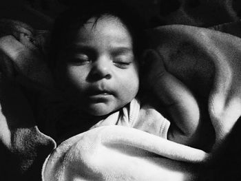 Portrait of cute girl sleeping on bed