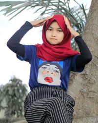 Portrait of happy girl standing outdoors