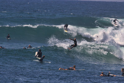 People swimming in sea